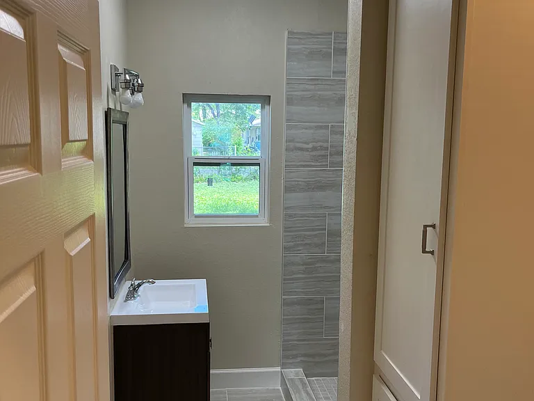 Bathroom with linen and laundry closet