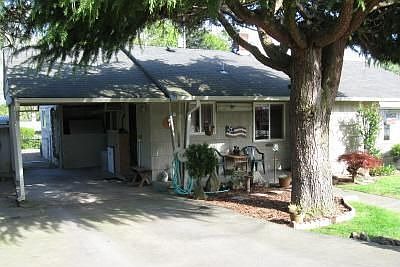 The attached carport provides covered parking.