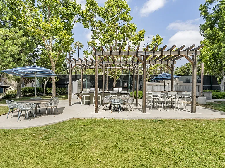 Next to the two community grills at The Summit, you'll find a handful of tables with chairsperfect for enjoying your meal and good company outdoors.