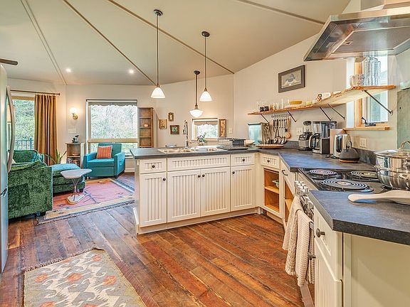 Comfy open concept with curated furnishings and finishes