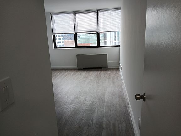 a spacious bedroom with a huge closet