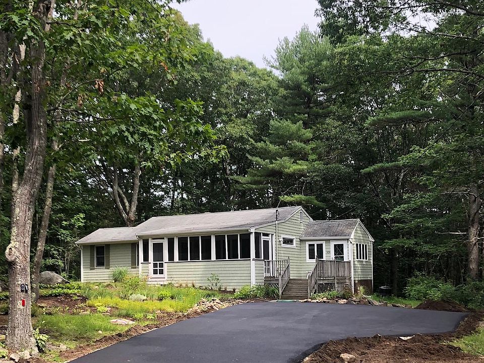 Ranch style house set back off road with brand new driveway that will accommodate three cars side-by side and up to five cars in the driveway for guests.