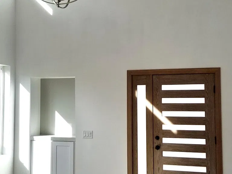 Double height Living Room. Built-in Bar. Lots of natural light
