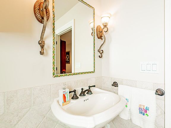 First floor 3/4 bathroom with access to the outside shower.