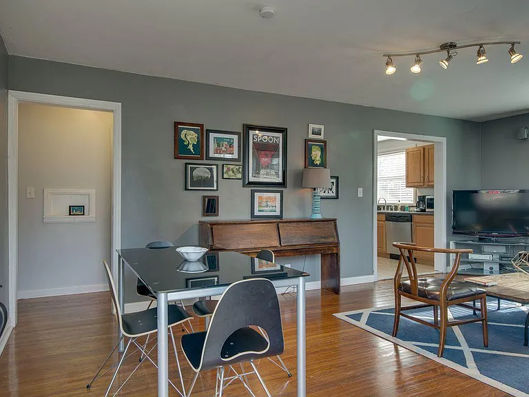 There is room for a table in the living room, but there is a separate dining space as well.