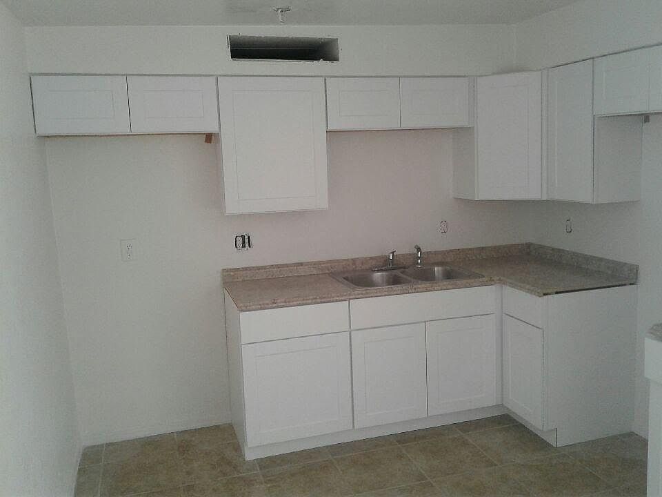 Kitchen features new cabinets, counters and appliances