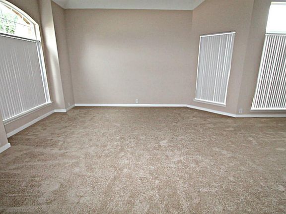 ENTERTAIN GUESTS IN UNCROWDED COMFORT IN THIS FORMAL LIVING ROOM