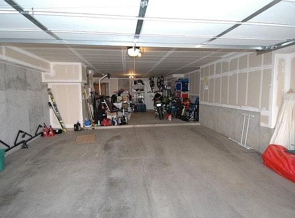 Oversized tuck under 2-car garage with storage room