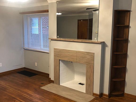 Built-in shelves next to the fireplace.