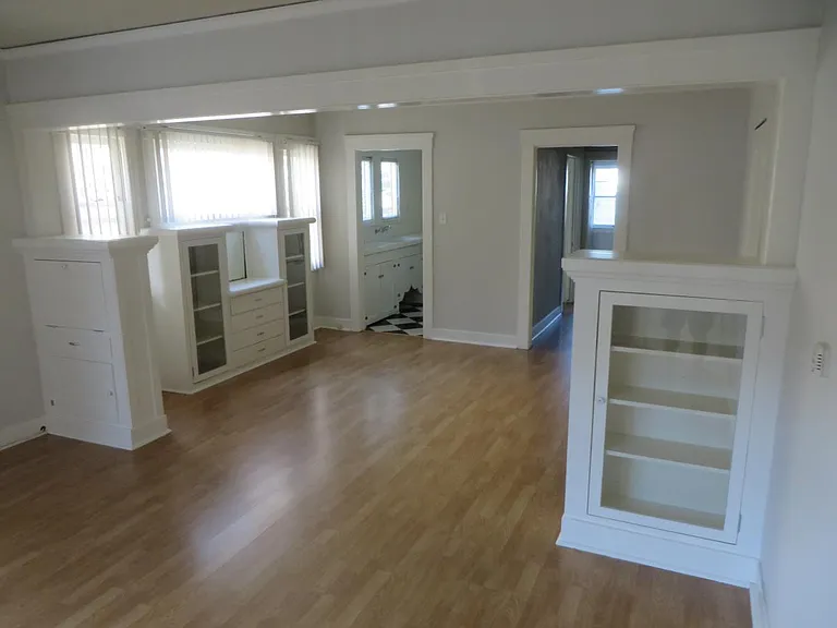 Living room and separate dining room with original craftsman