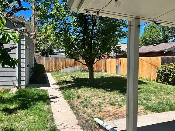 Back yard with detached single car garage