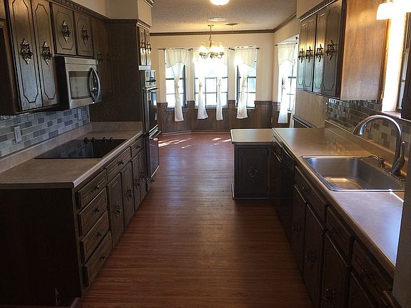 Galley kitchen and dining