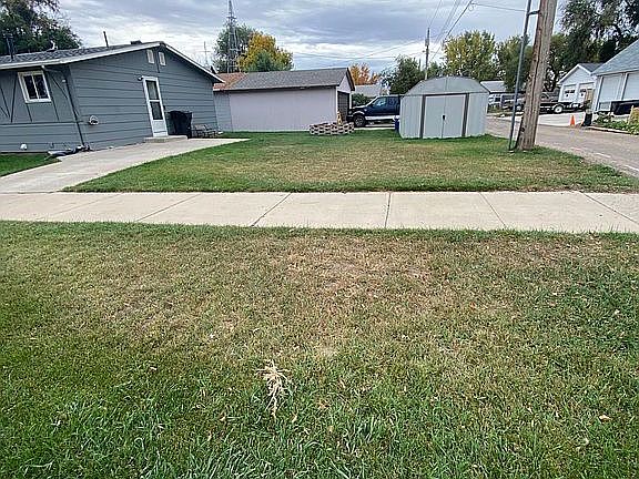 Side yard, shed & driveway