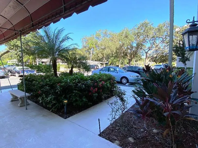 walkway from front lobby to parking area.
