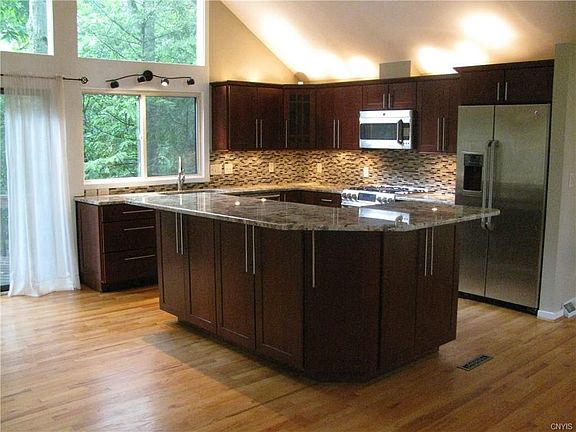 Completely Updated Gourmet Cherry Kitchen with SS appliances, Granite, Overhead and Under the counter lighting. This is a True Chef's Dream Kitchen!!
