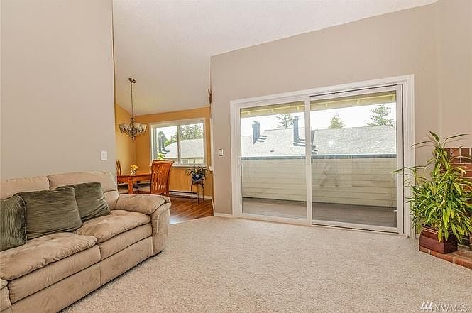 Living room, dining area, and deck