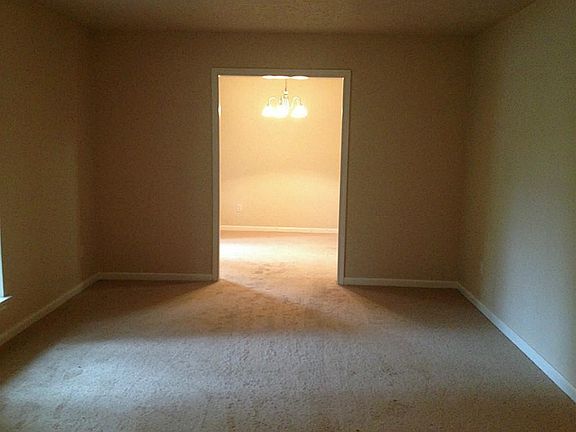  Formal living room at the front of the house with the formal dining at the other end.