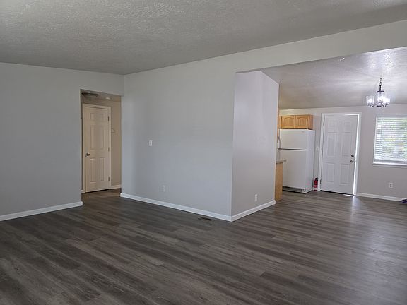 From corner of Livingroom showing diningroom on right and hall on left