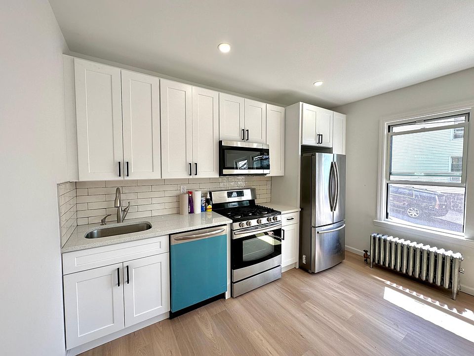 Large Stainless Steel Dishwasher and modern recessed lighting.