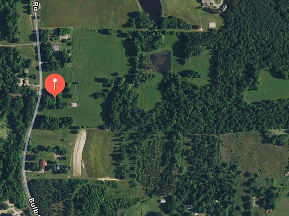 Between 2 large homes/lots