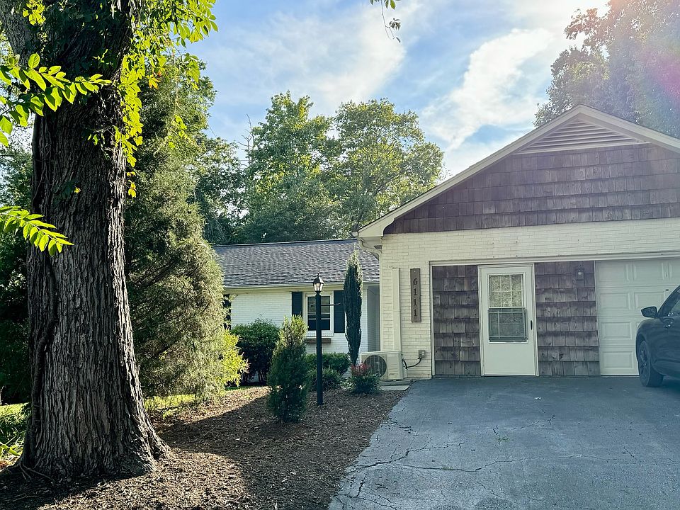 Front view of the home. Garage access, flex room door and then front door to the left/center of photo