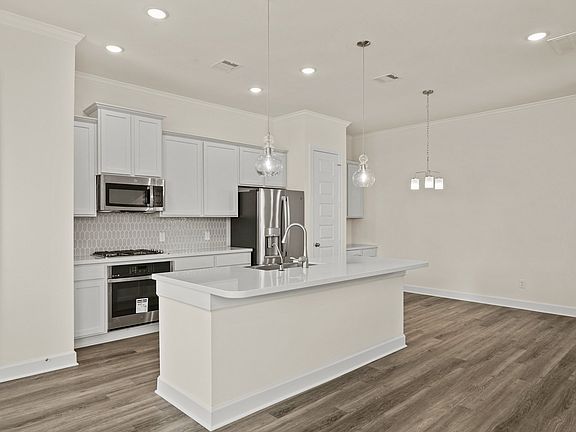 Kitchen with stainless-steel appliances