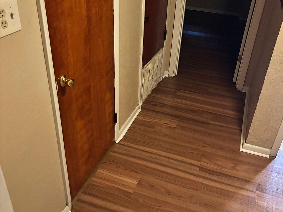 Hallway with storage closet on left