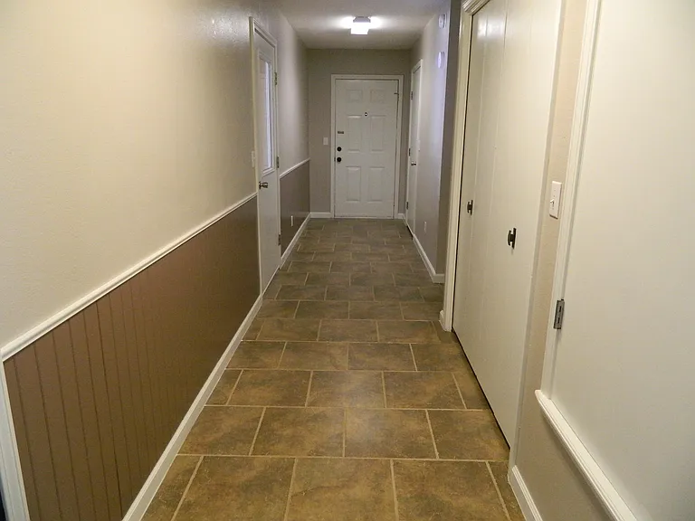 hallway to garage, laundry and storage room