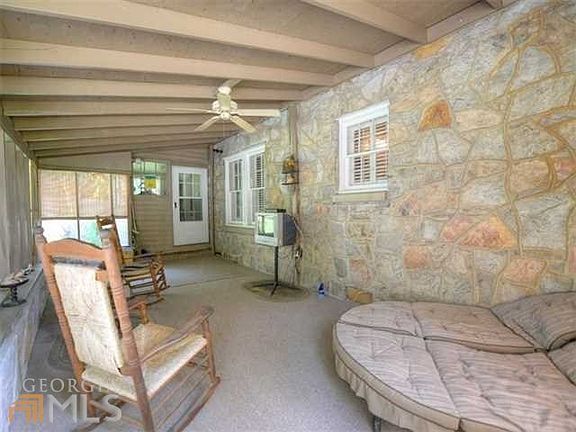 Large screened porch on the back of the house overlooking the private backyard!