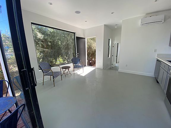 Open floor plan- kitchen and living room. Blue tooth speakers in the ceiling for a luxurious surround sound experience!