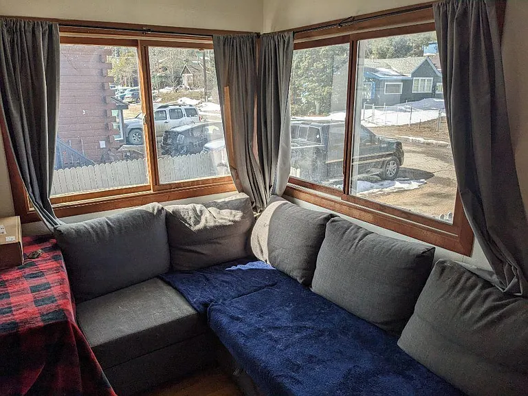 Open living room with south and west windows for sun all day.