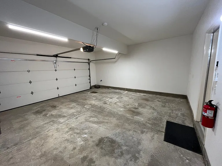 Oversized, finished garage with bright LED lighting