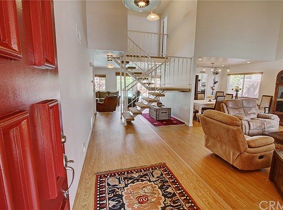 Enter onto new honey wood floors throughout the Formal Living Room, Dining Room, Family Room and Kitchen.