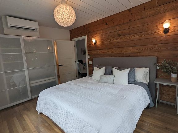 Unit B king bed with heat/ac. Closet with sliding doors.