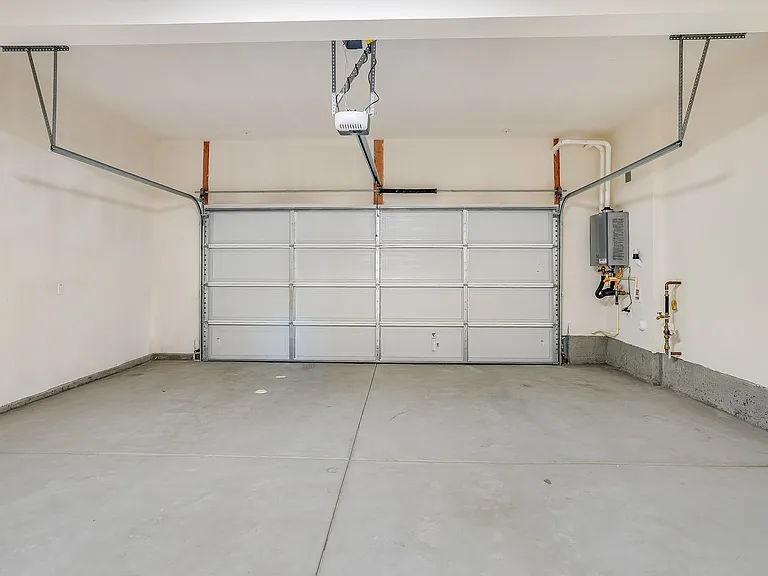 Attached two and three car garages with charging options available