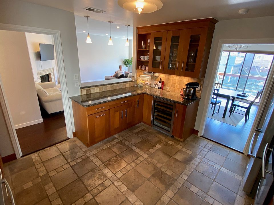 Kitchen with view toward breakfast bar and dining area