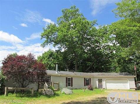 Large manufactured home with 2 stall attached garage.