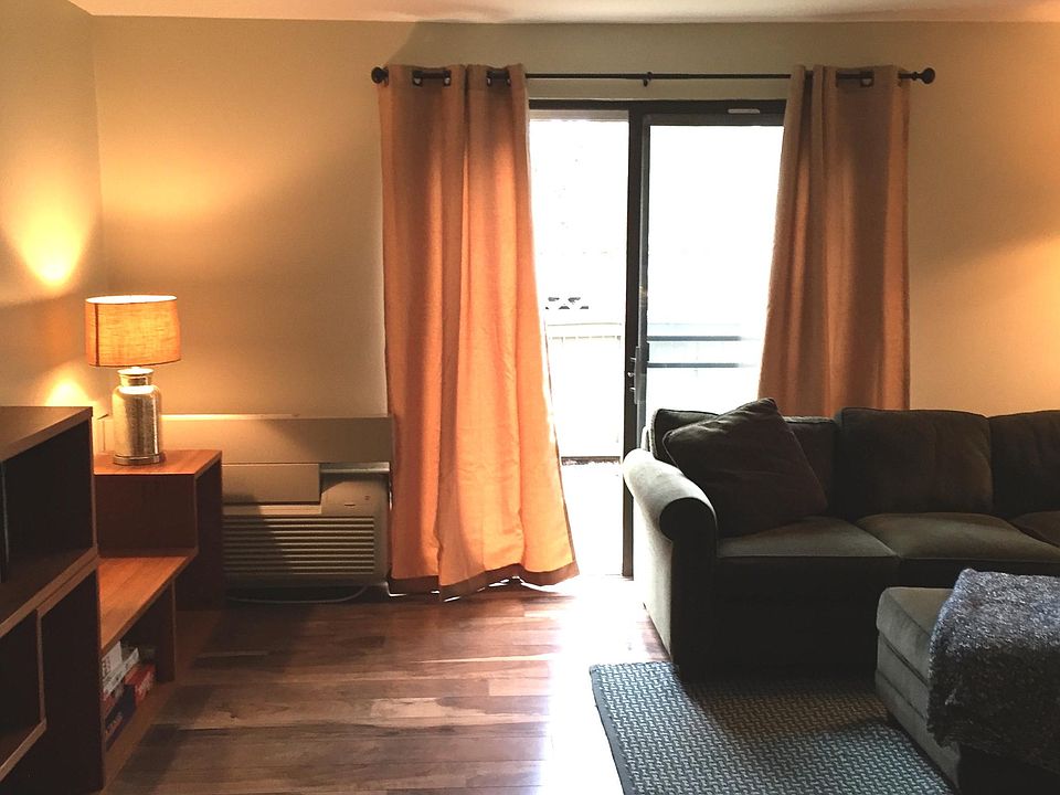 Living Room looking out to enclosed patio (BBQs allowed)