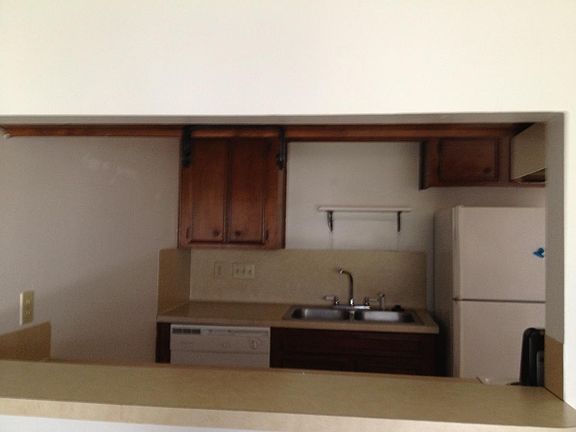 kitchen opens up to living room