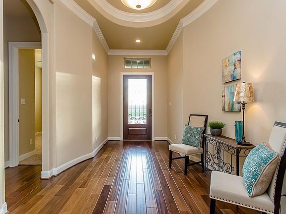 Attention to detail and design can be seen throughout this home. Starting with the extensive molding, hand scraped wood floors, and fabulous architecture of the entry.