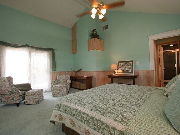 Large master bedroom with french doors to deck
