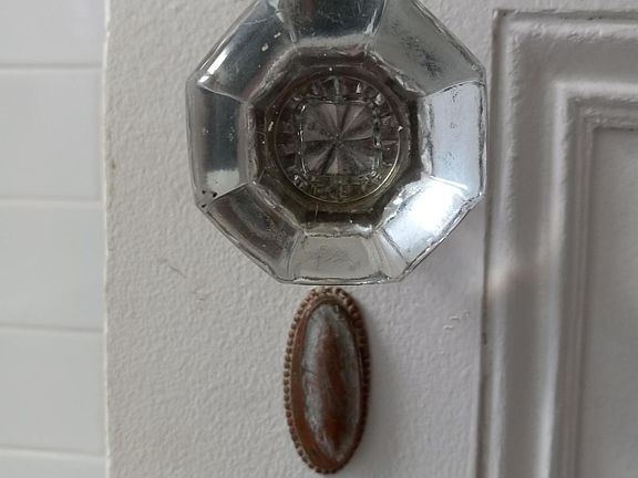 There are handsome architectural details throughout including the original glass knobs and brass escutcheons.