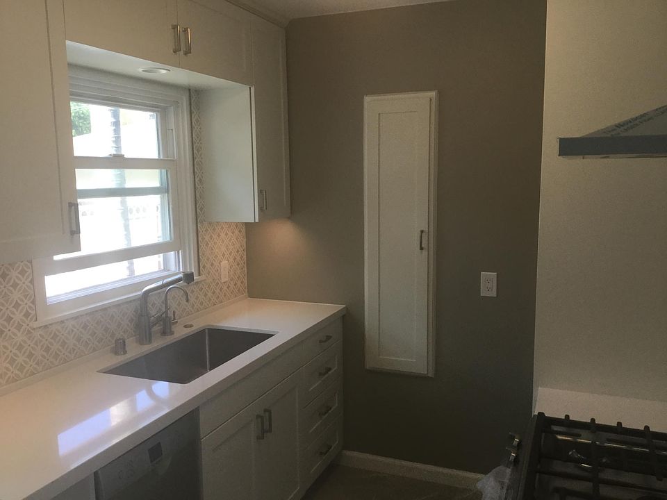 Custom kitchen showing large spice cabinet