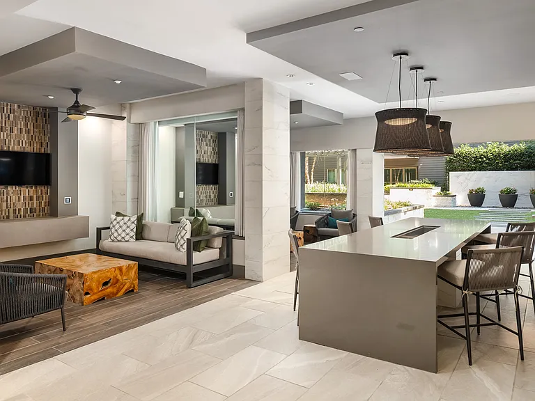 Indoor Lounge Space with Dining Island and Outdoor Courtyard Access