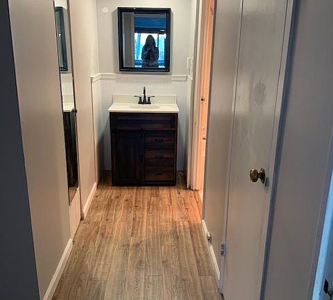 Hallway between bedroom and bathroom