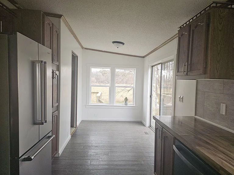 Large Kitchen opens to a nice size morning room. Perfect location for a little breakfast table. A great place to sit and enjoy your morning coffee with tons of natural light.
