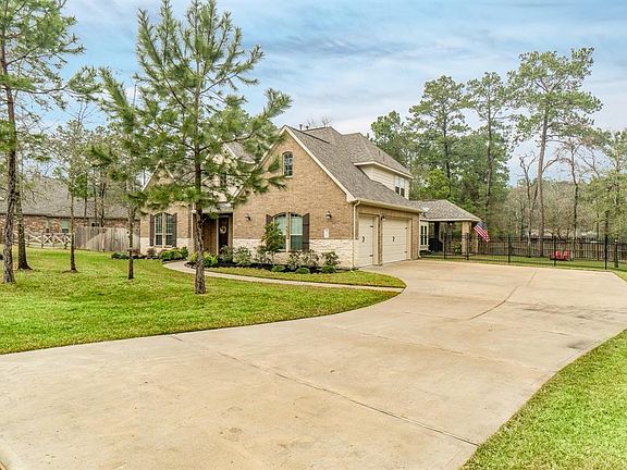 Double wide driveway all the way to the three car garage.