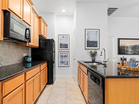 The kitchen is equipped with a full sized fridge, microwave, dishwasher, disposal and laundry closet (we will supply the stackable laundry unit). 
Please note that we are also going to supply a countertop stove and large countertop convectional oven.