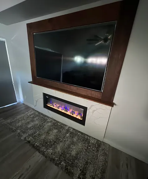See through fireplace to second living room. Each has it's own Smart tv