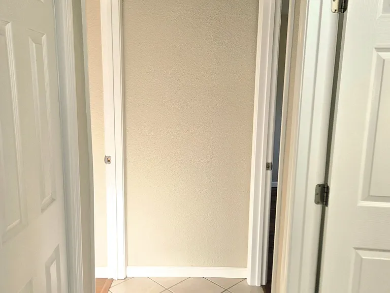 Hallway, left-side washer-dryer closet. Right side 1st bathroom.